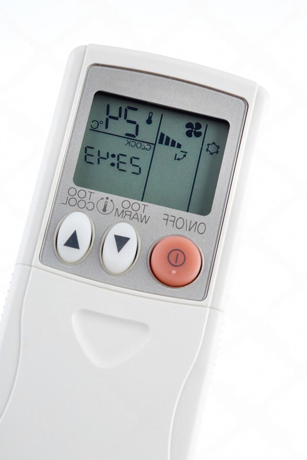 Close-up of a portable air cooler remote showing fan speed and temperature controls